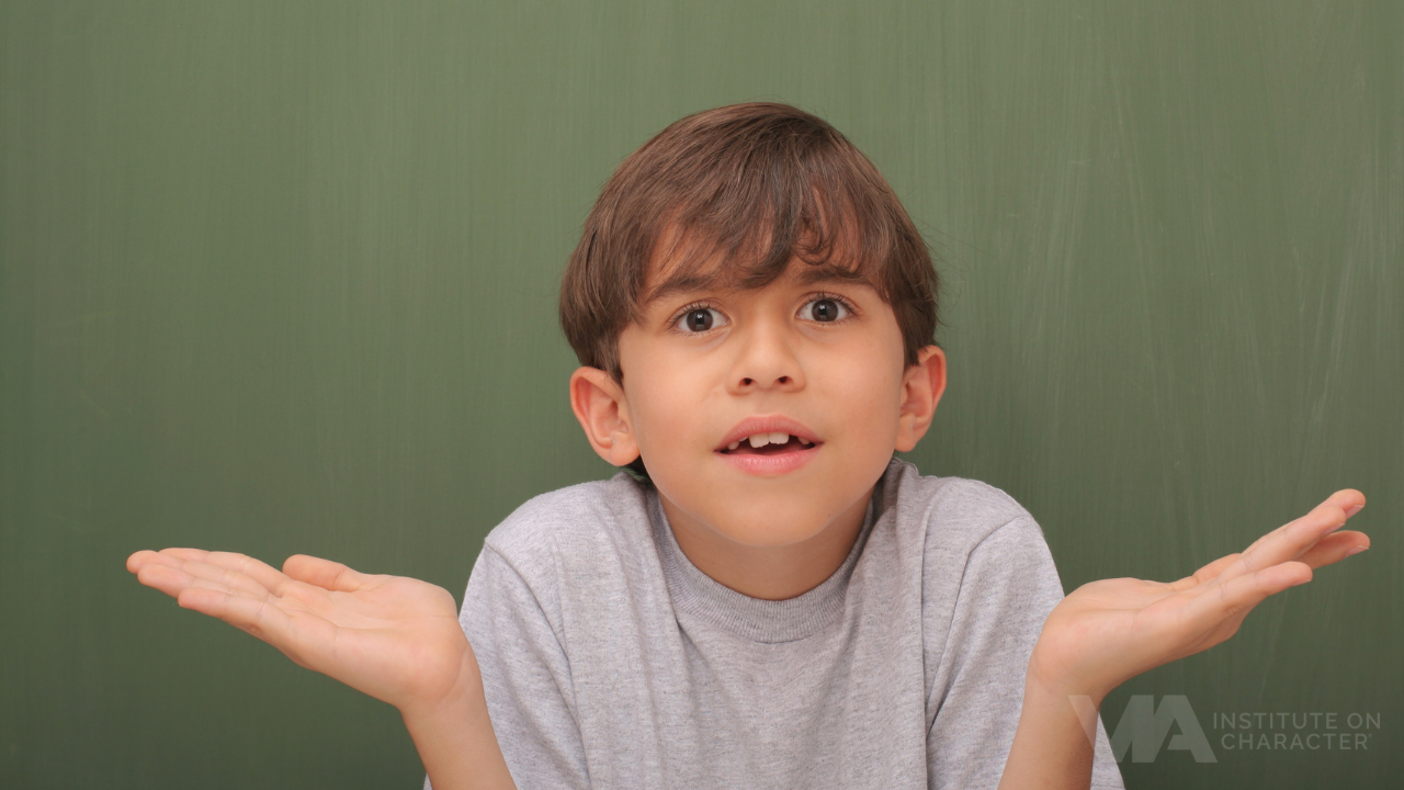 A child with arms raised, wondering what mindfulness is.